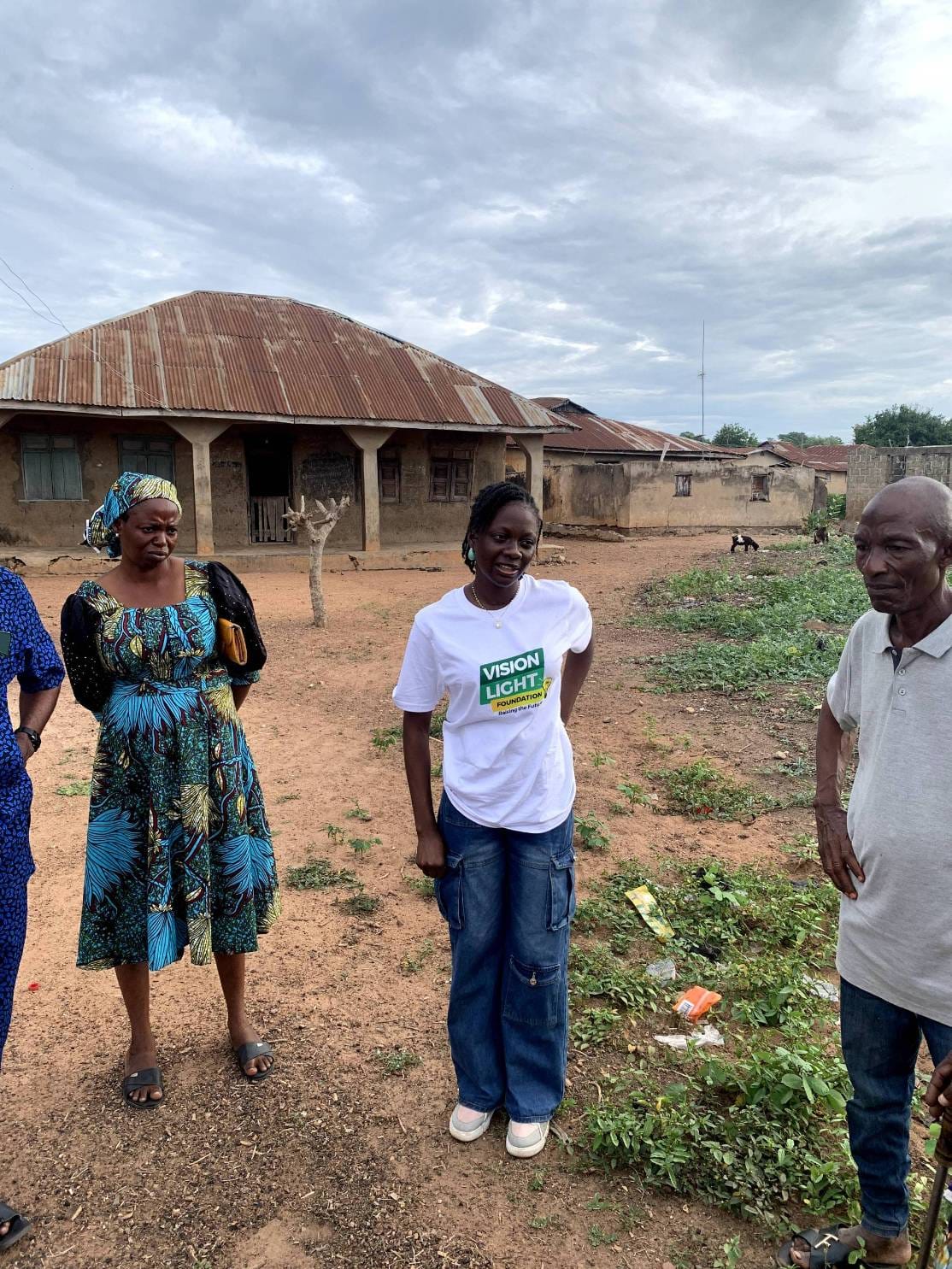 Volunteers meeting community members during a visit